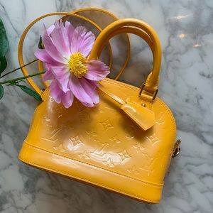 Mint condition Louis Vuitton Alma BB in “mango”
